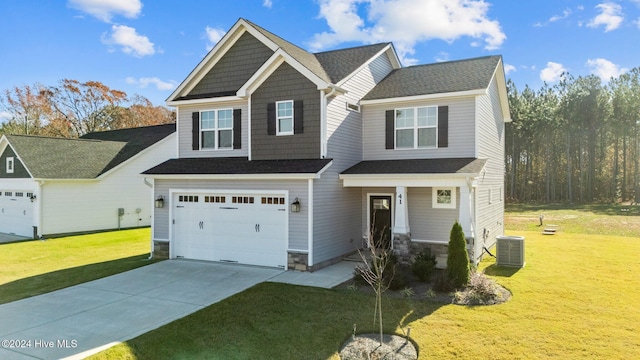 craftsman-style home with a garage, a front yard, and central air condition unit