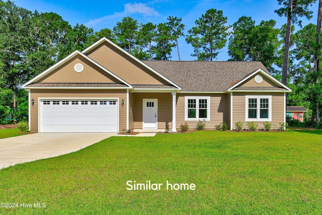 craftsman house with a garage and a front lawn