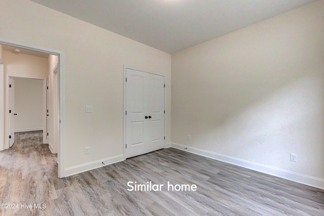 unfurnished bedroom with light hardwood / wood-style floors