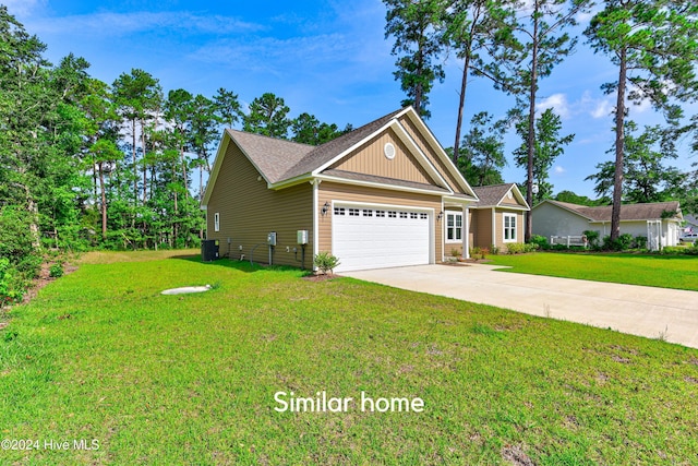 view of front of property featuring a garage, central AC, and a front lawn