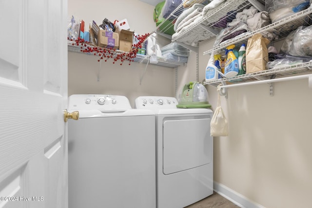 laundry room featuring separate washer and dryer