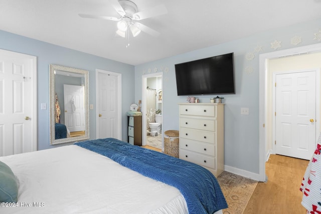 bedroom featuring ensuite bathroom, light hardwood / wood-style floors, and ceiling fan