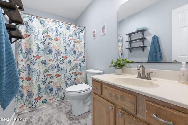 bathroom featuring vanity and toilet