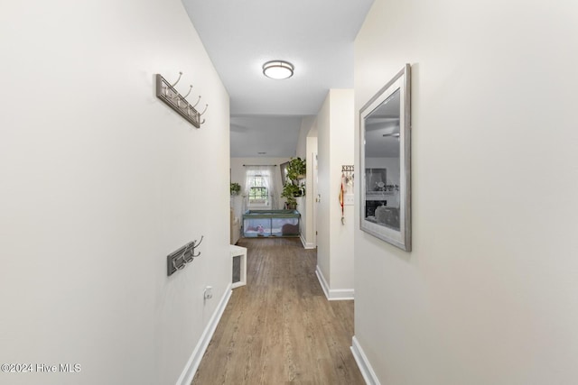 corridor featuring light hardwood / wood-style flooring