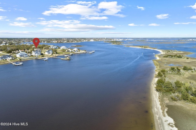 drone / aerial view with a water view and a view of the beach