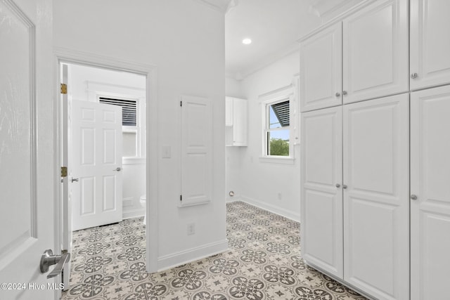 corridor with light tile patterned floors