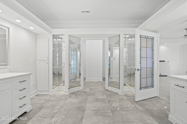 bathroom featuring vanity, french doors, a shower with door, and ornamental molding