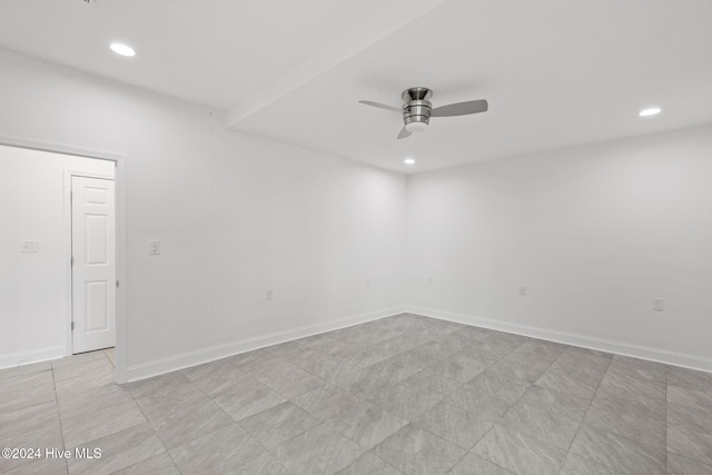 spare room featuring ceiling fan