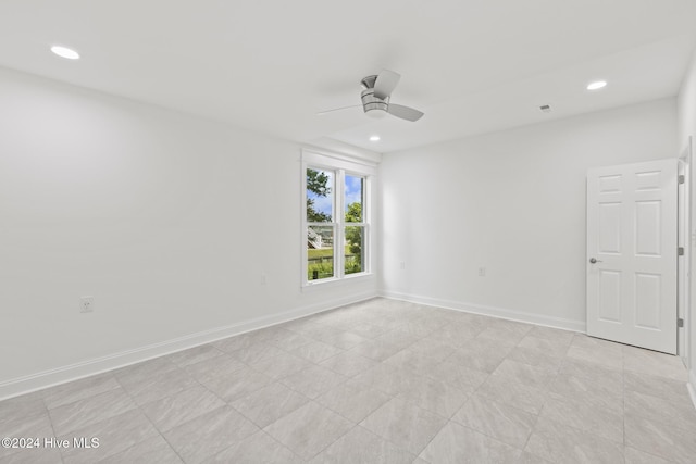 spare room with ceiling fan