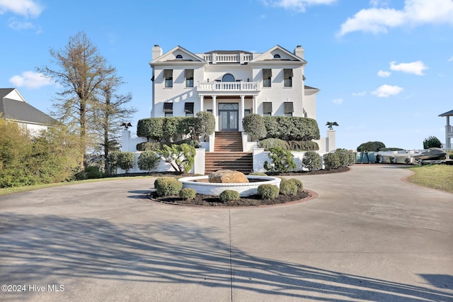 view of front of home with a balcony