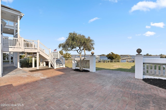 view of patio / terrace featuring a water view