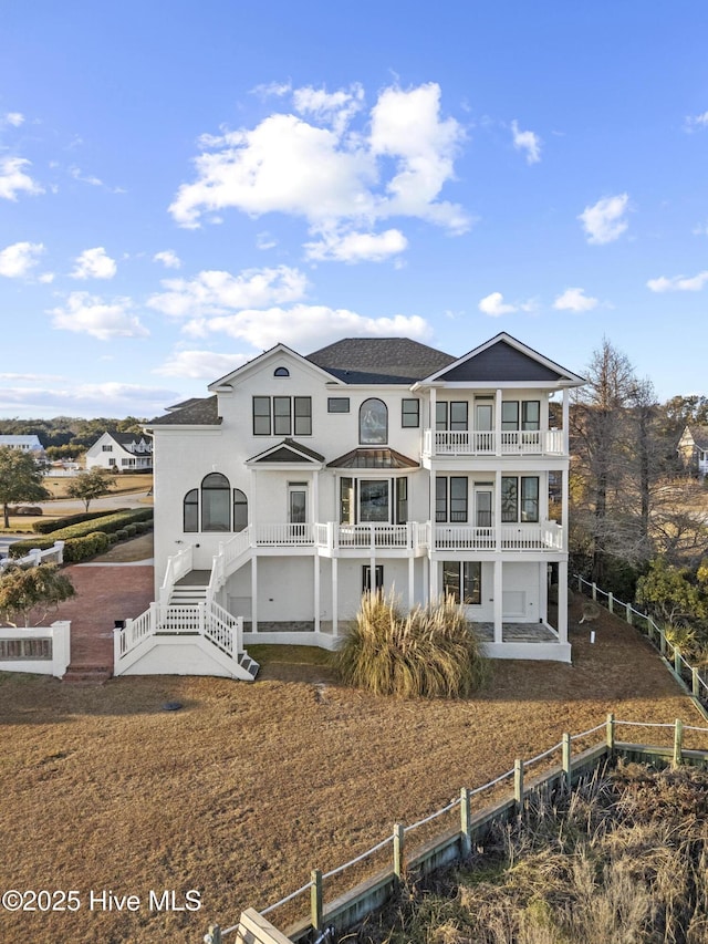 back of property with a balcony