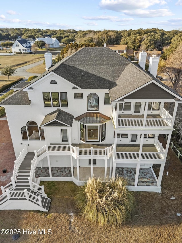 back of house with a balcony