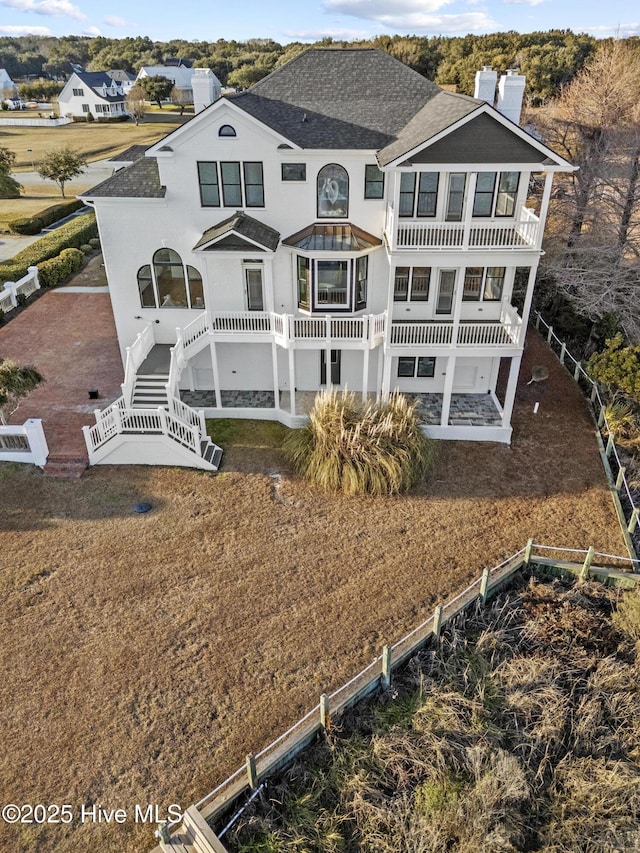 rear view of house with a balcony