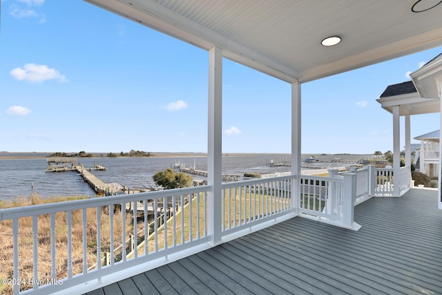 wooden deck with a water view