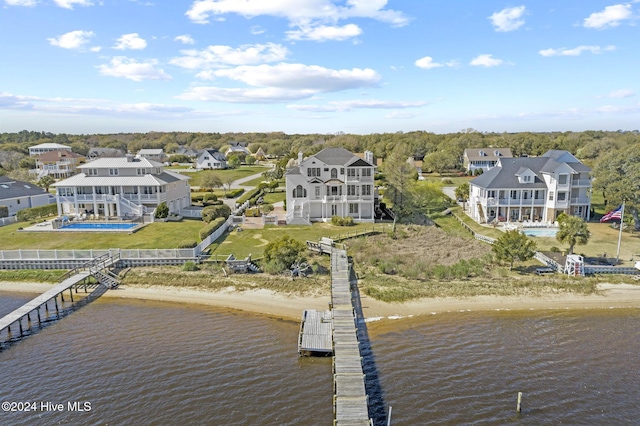 view of dock featuring a view of the beach and a water view