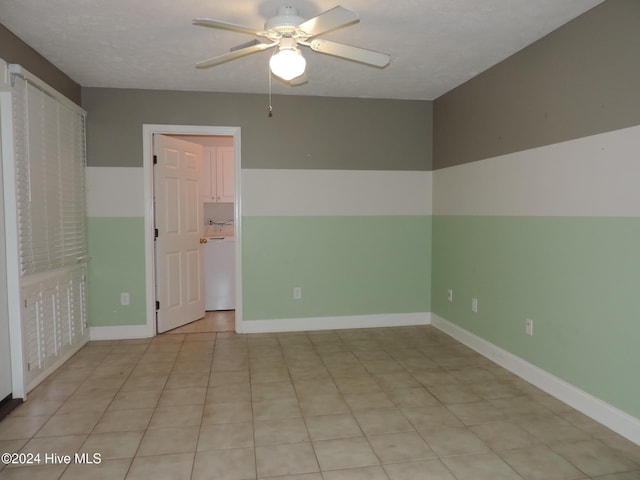 empty room featuring a textured ceiling and ceiling fan