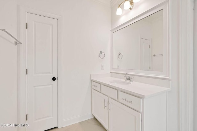 bathroom with vanity and crown molding