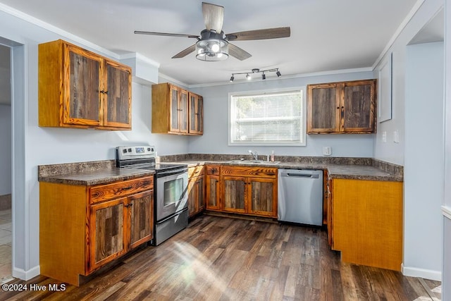 kitchen with ceiling fan, sink, dark hardwood / wood-style floors, appliances with stainless steel finishes, and ornamental molding