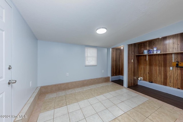 basement featuring light tile patterned floors