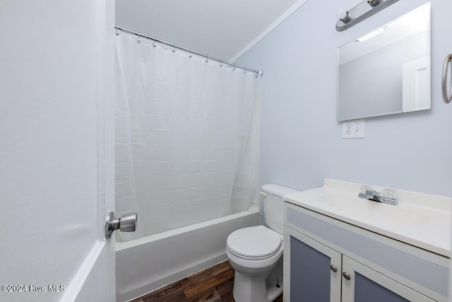 full bathroom featuring crown molding, wood-type flooring, toilet, vanity, and shower / tub combo