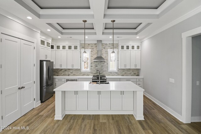 room details featuring backsplash, light stone countertops, white cabinets, and stainless steel dishwasher