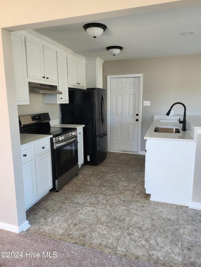 kitchen with sink, white cabinetry, and stainless steel range oven