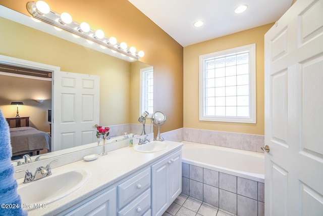 bathroom featuring tile patterned floors, separate shower and tub, and vanity