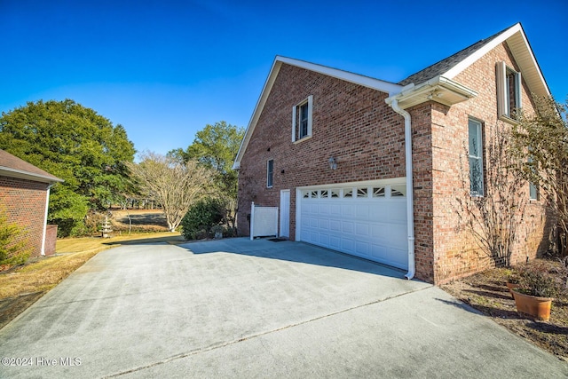 view of side of home with a garage