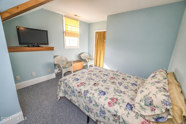 carpeted bedroom featuring vaulted ceiling