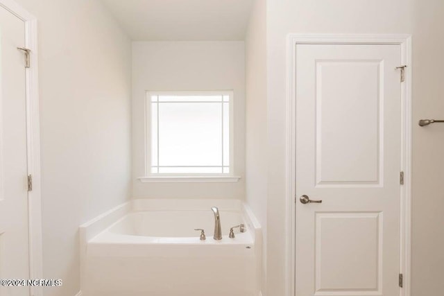 bathroom with a washtub