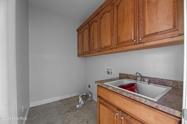 laundry area with cabinets, hookup for a washing machine, electric dryer hookup, and sink