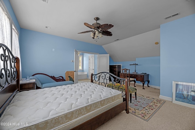 bedroom featuring multiple windows, ceiling fan, light colored carpet, and vaulted ceiling