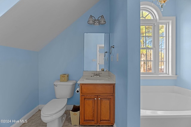 bathroom with vanity, lofted ceiling, a bath, tile patterned floors, and toilet