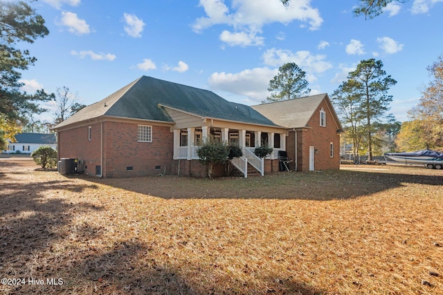 rear view of property featuring cooling unit