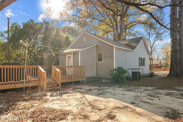 view of home's exterior featuring a deck and central air condition unit