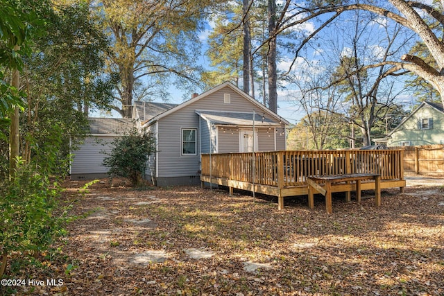 back of property with a wooden deck