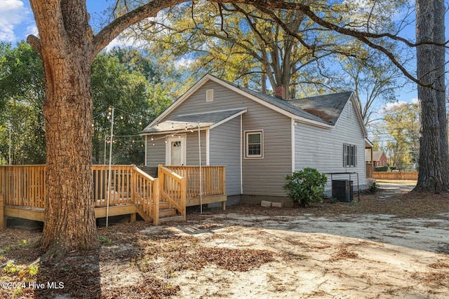 rear view of house with a wooden deck