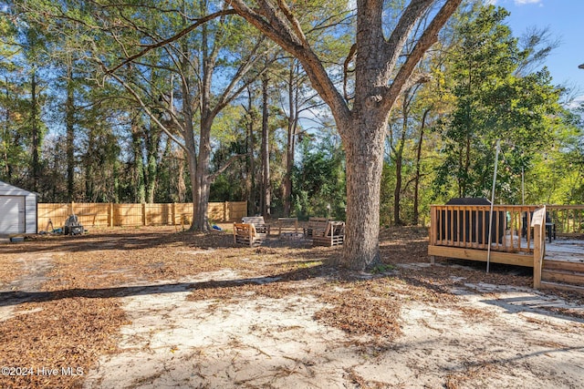 view of yard with a wooden deck