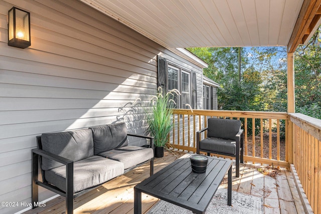 wooden terrace with outdoor lounge area