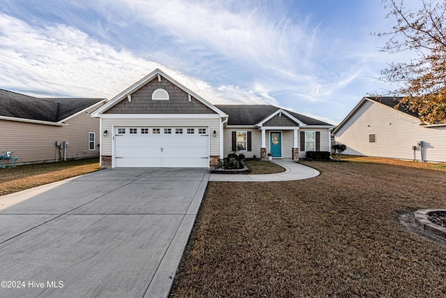 view of front of house with a garage and a front yard