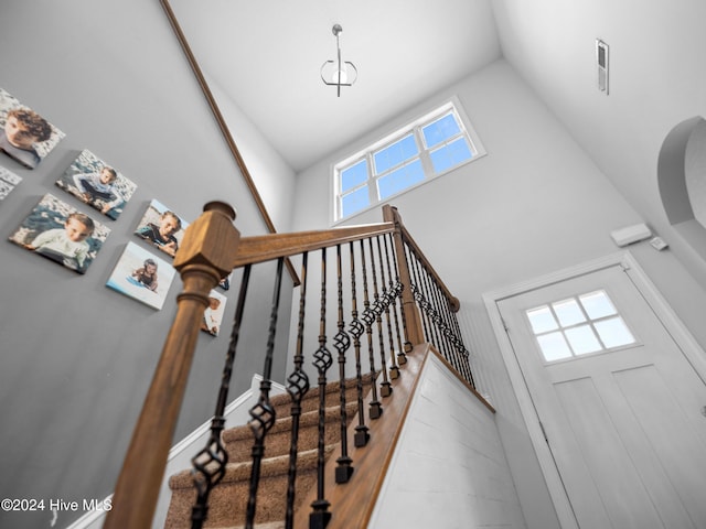 stairway with a high ceiling