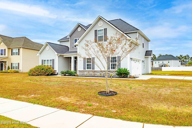 view of front of house featuring a garage and a front yard