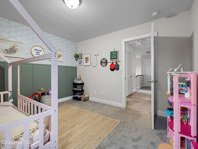 carpeted bedroom with a textured ceiling