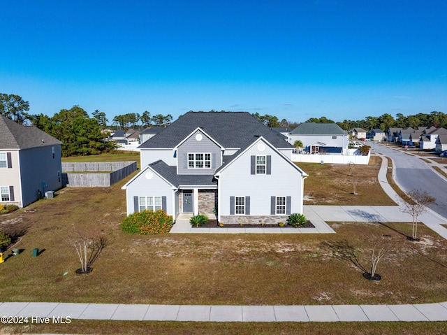 view of front of home featuring a front lawn