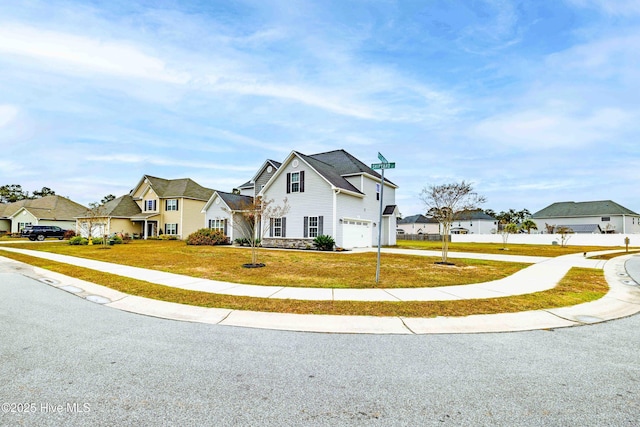 view of front facade with a front lawn and a garage