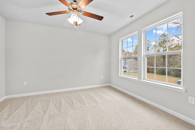 empty room with carpet and ceiling fan