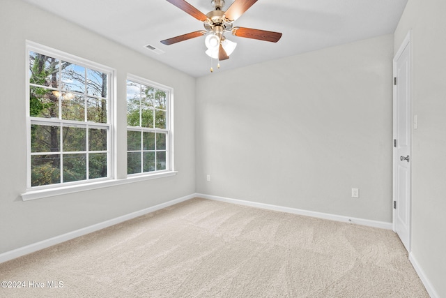 carpeted empty room with ceiling fan