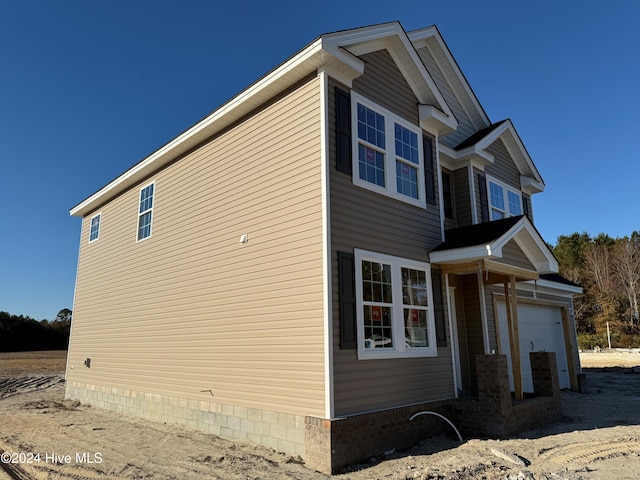 view of home's exterior with a garage