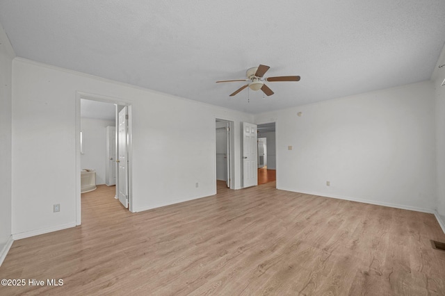 unfurnished bedroom with ceiling fan, connected bathroom, light hardwood / wood-style flooring, and a textured ceiling